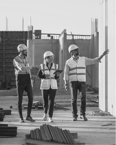 Three site inspectors in safety vests