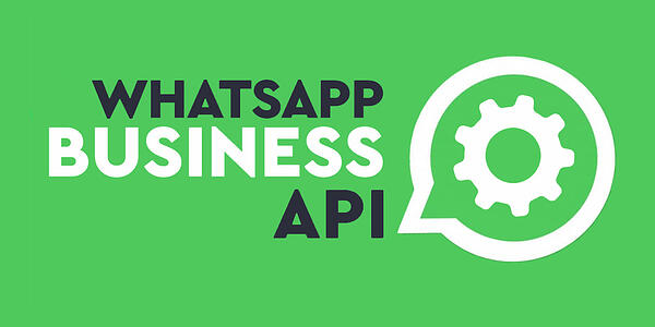 'WhatsApp Business API' on a bright green background with a logo of a gear within a speech bubble.