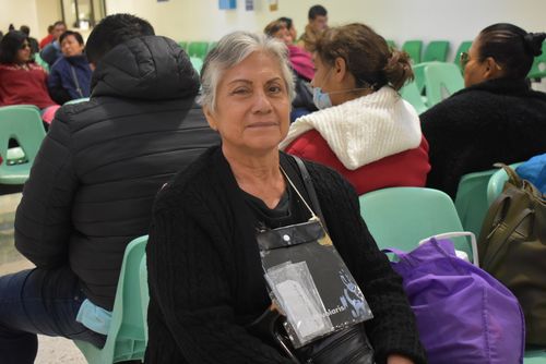 Young woman wearing glasses smiles