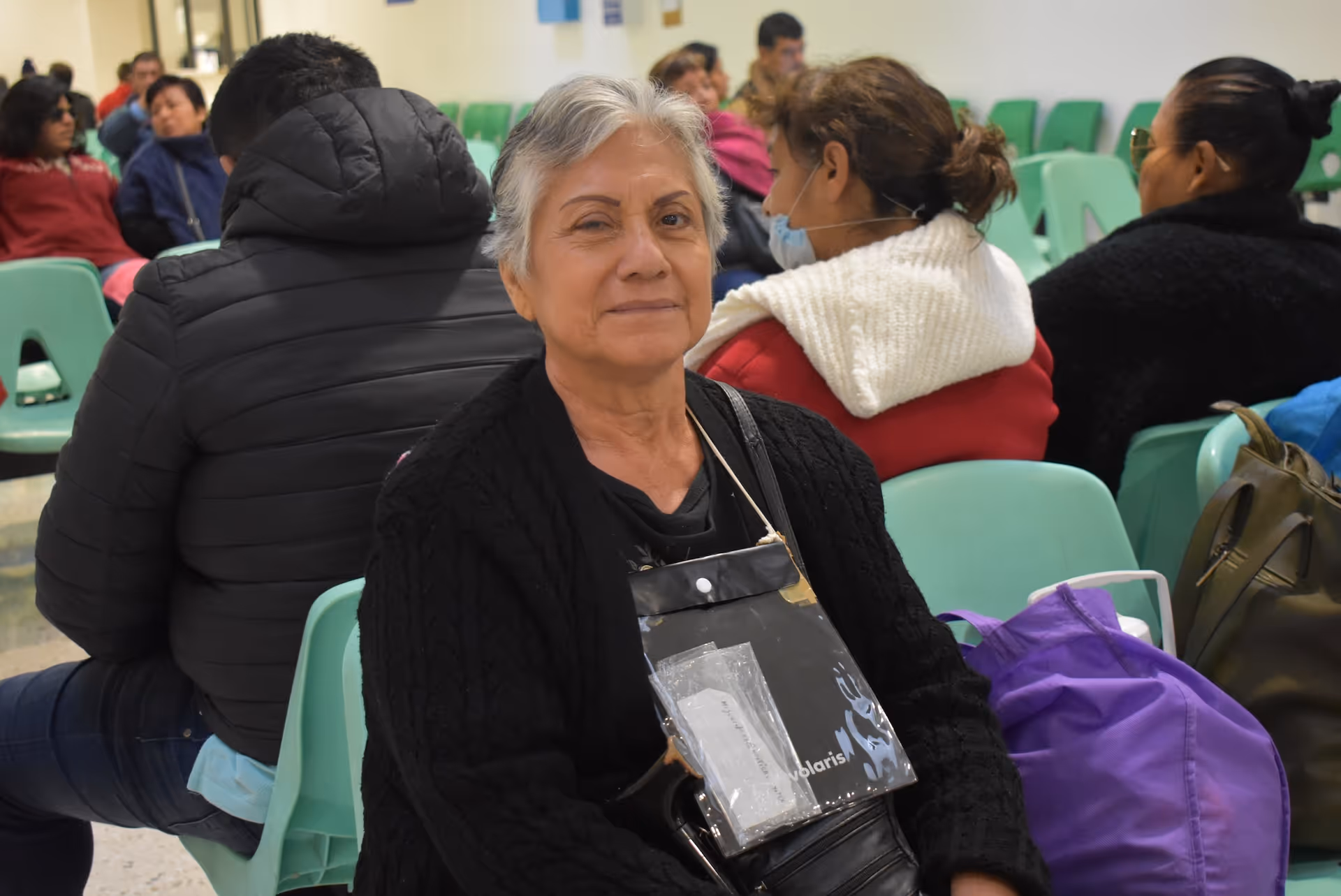 Young woman wearing glasses smiles