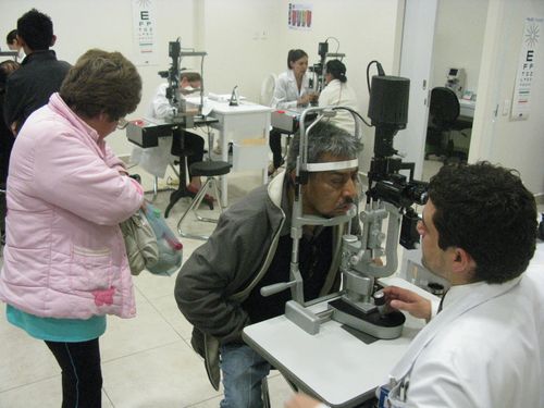 Young woman wearing glasses smiles