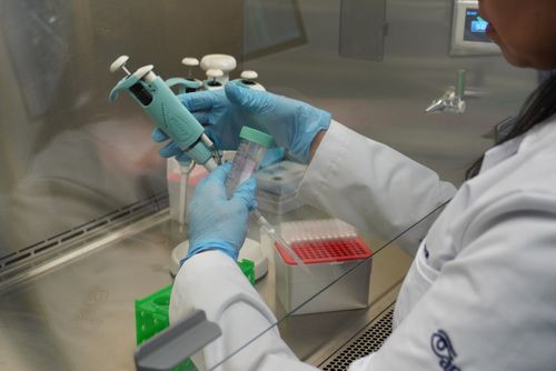 Young woman wearing glasses smiles