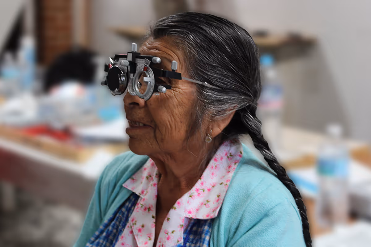 Young woman wearing glasses smiles