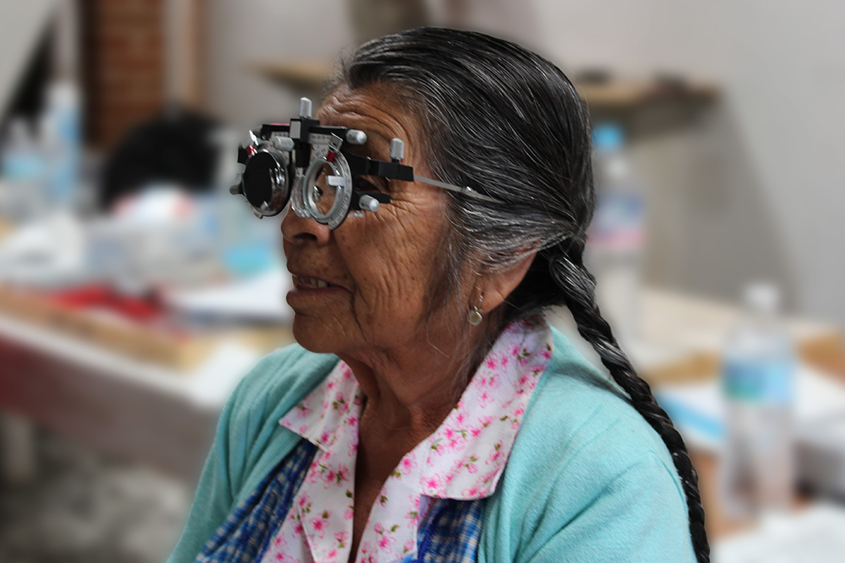 Young woman wearing glasses smiles