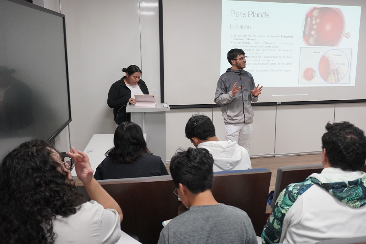 Young woman wearing glasses smiles