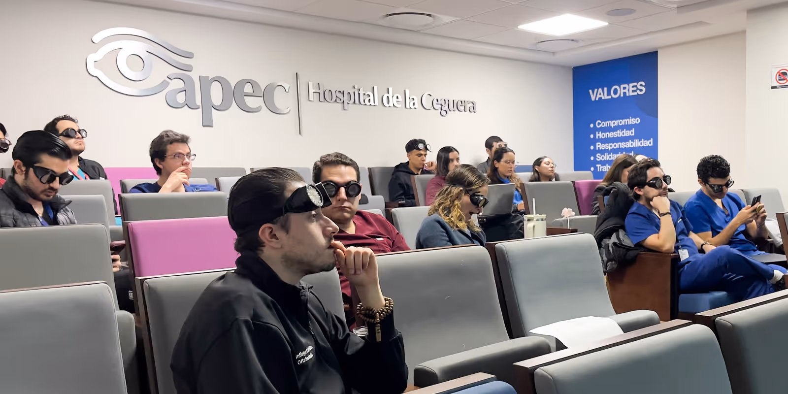 Young woman wearing glasses smiles