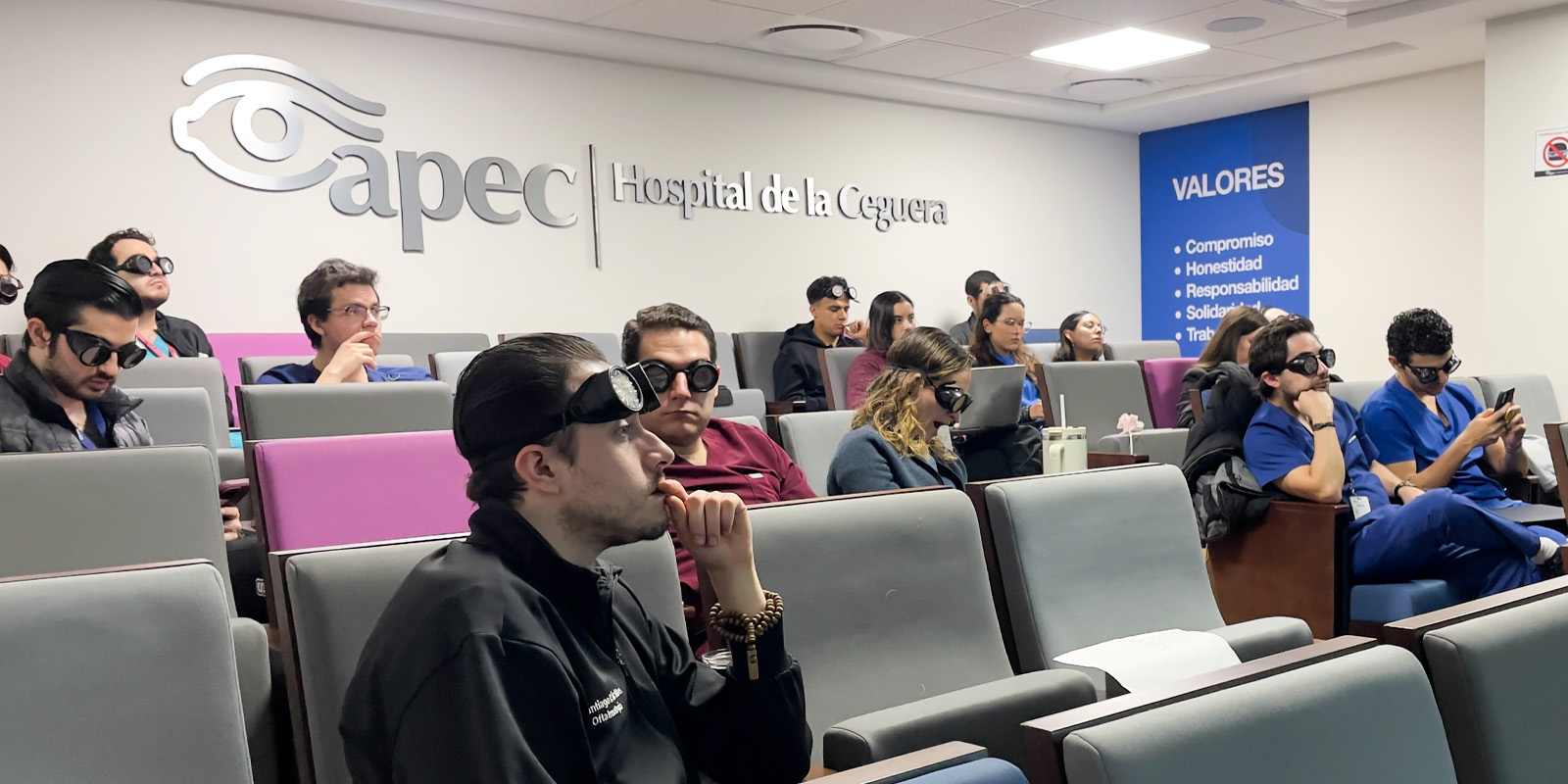 Young woman wearing glasses smiles