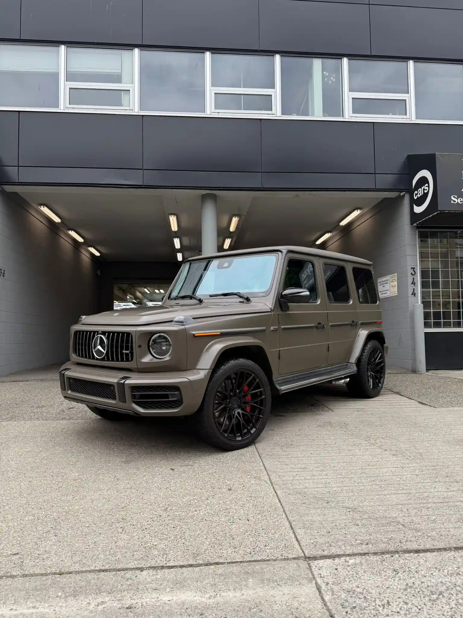 Green Mercedes G-Wagon parked outside Crown Auto Glass Vancouver location