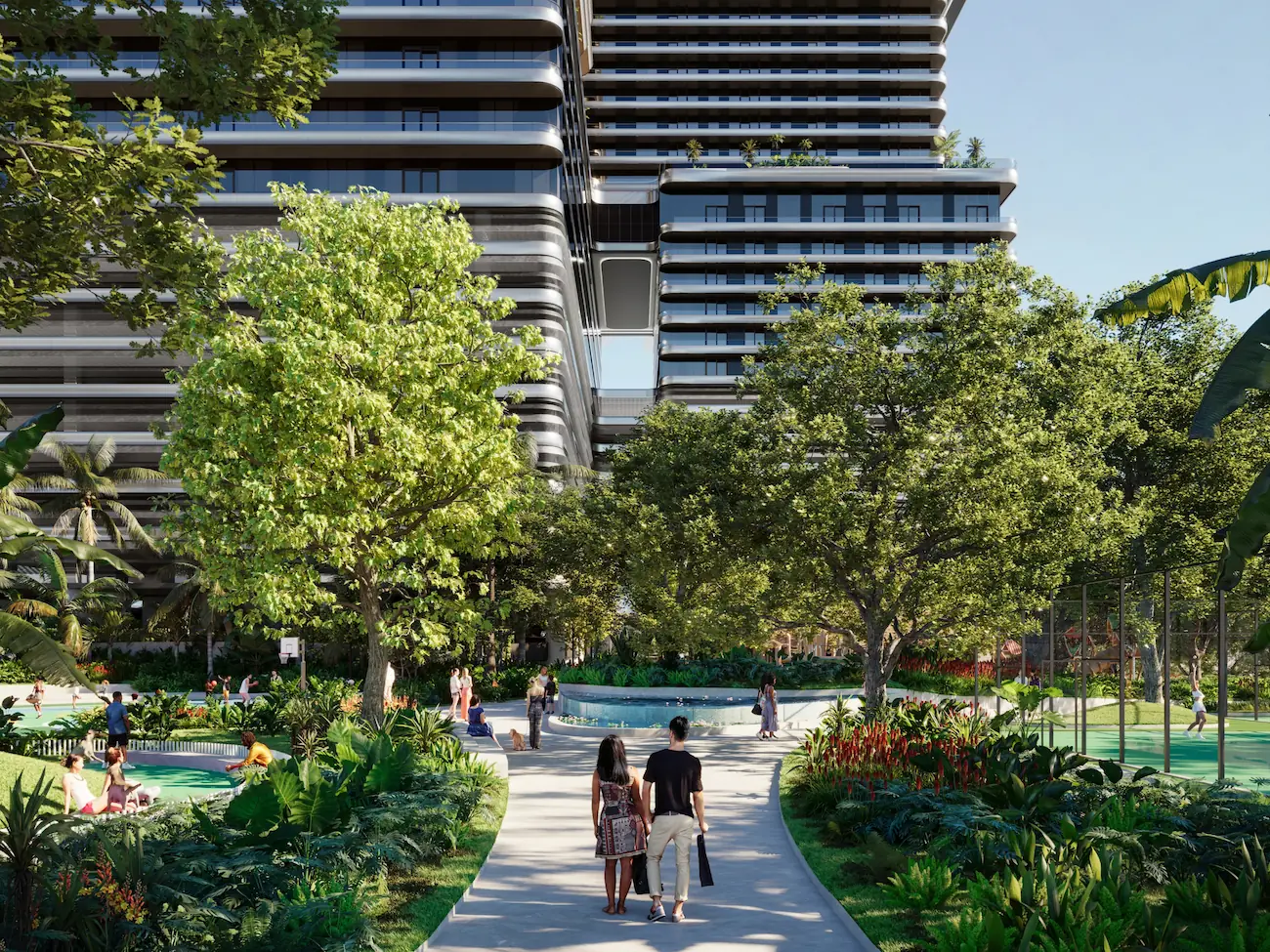 Pedestrian garden pathways at Mercedes-Benz Places with shaded green spaces and tower backdrop.