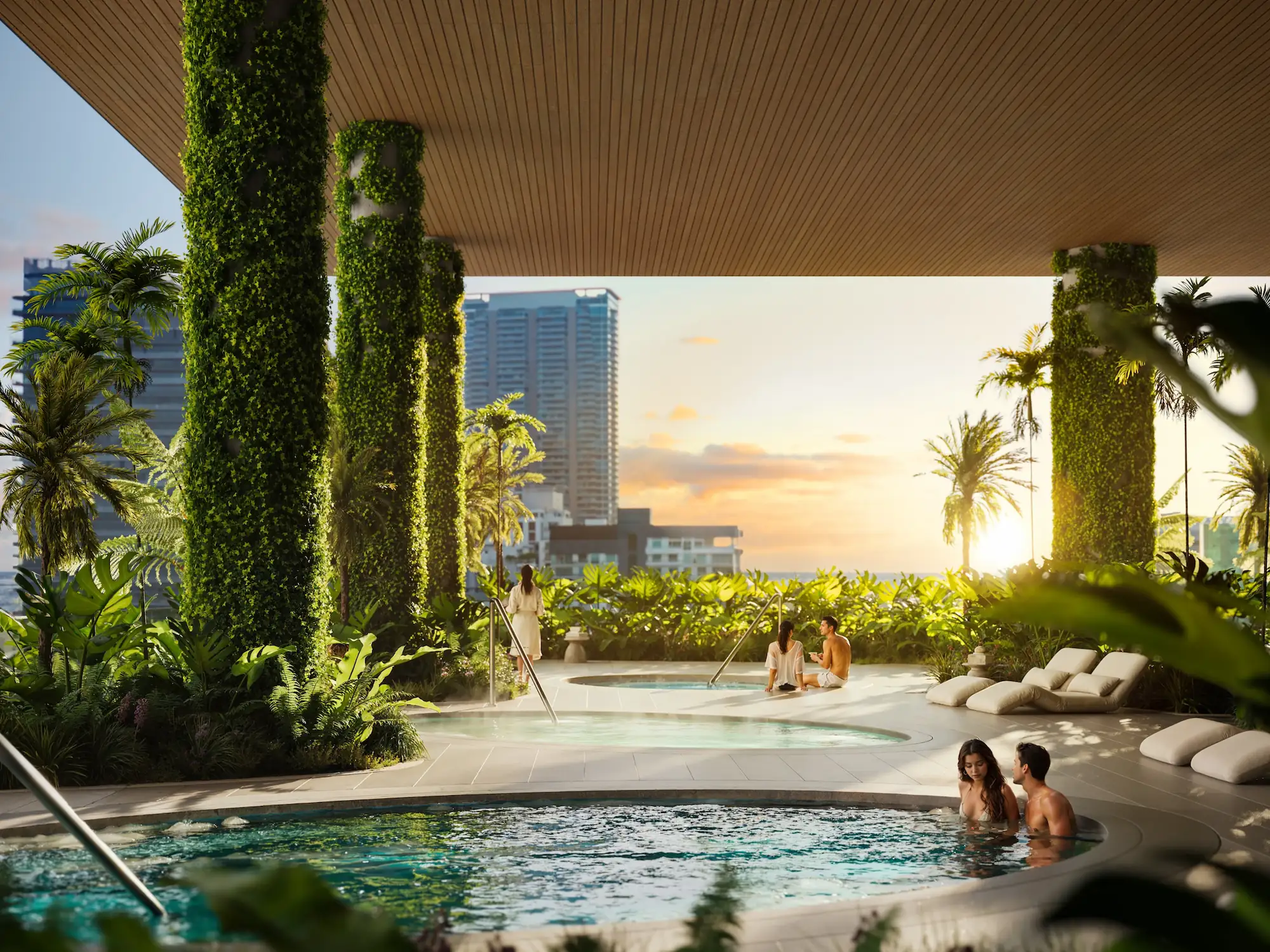 Resort pool area featuring vertical gardens and sunset views.