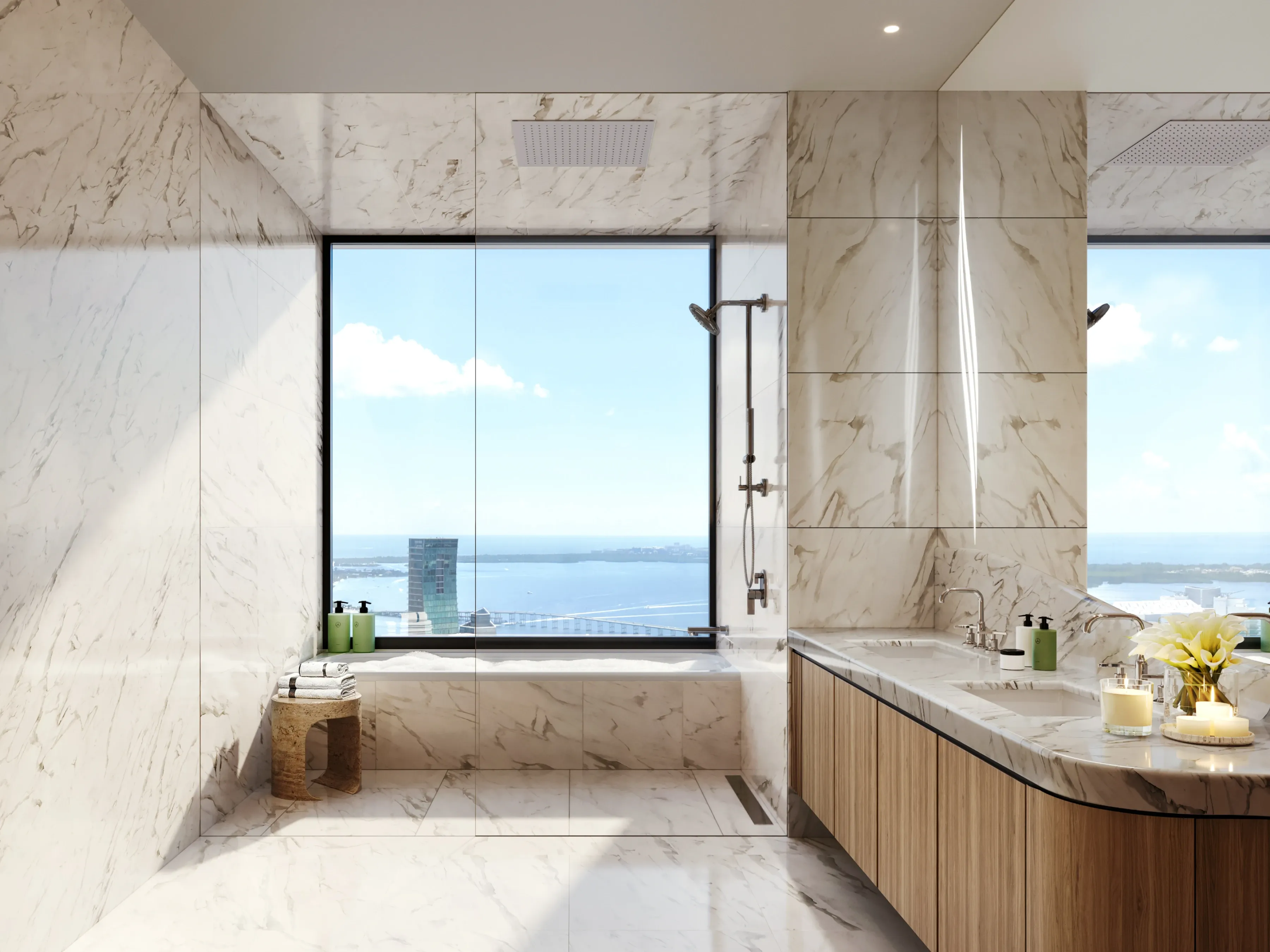 Luxury bathroom with freestanding tub, marble finishes, and ocean views.