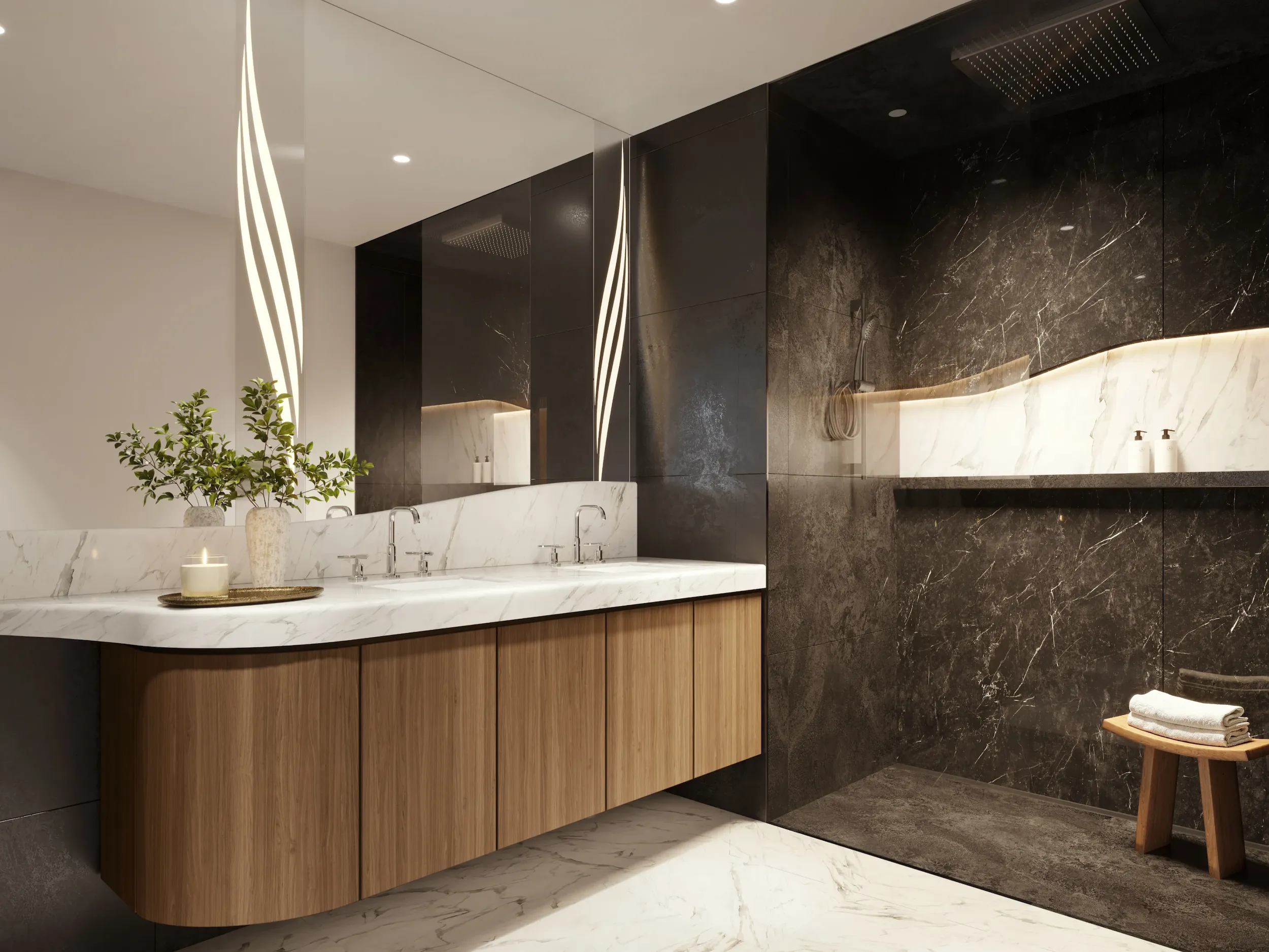 Contemporary kitchen with dark stone surfaces, warm lighting, and built-in appliances.