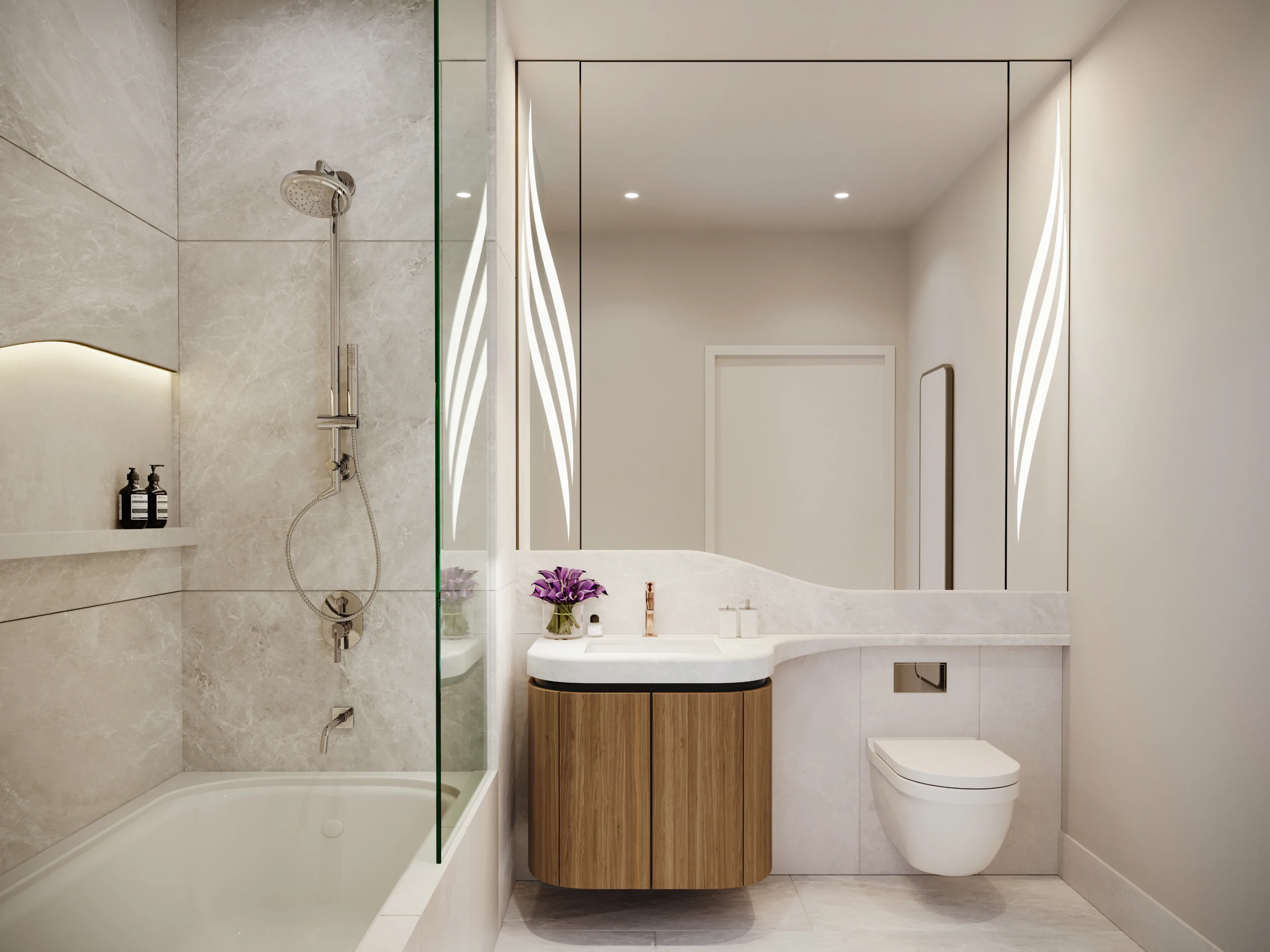 Modern bathroom with glass-enclosed shower, gold fixtures, and neutral stone materials.
