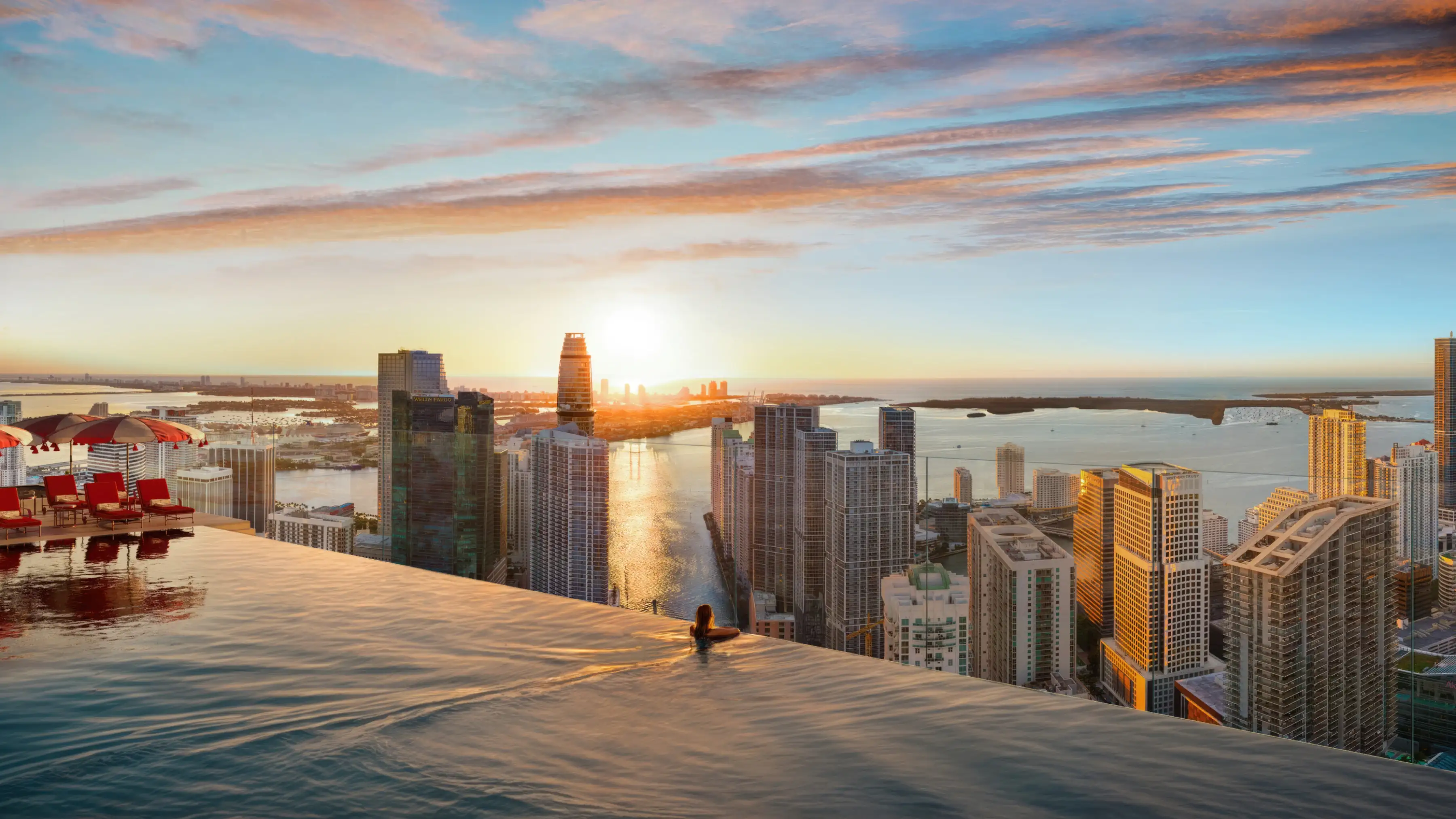 Infinity pool overlooking the Miami skyline at sunset at Faena Residences.