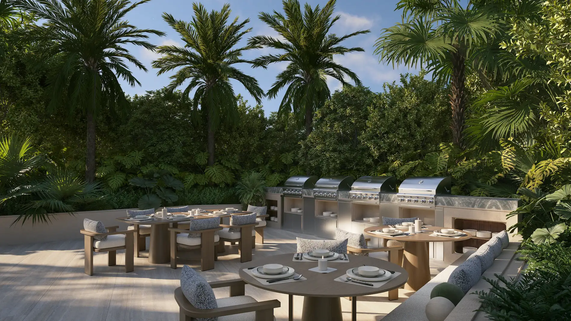 Outdoor dining and lounge pavilion at Edge House Miami with lush landscaping.