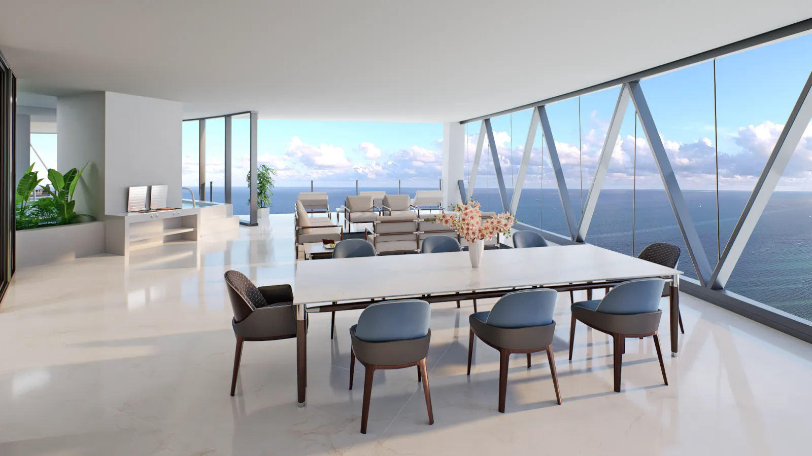 Outdoor dining area on a private terrace overlooking the Atlantic Ocean at Bentley Residences Sunny Isles.