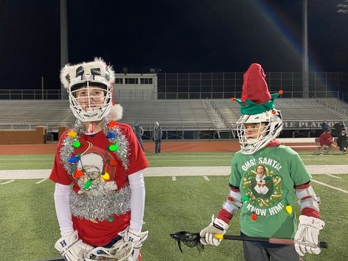 Surfer sitting on the beach