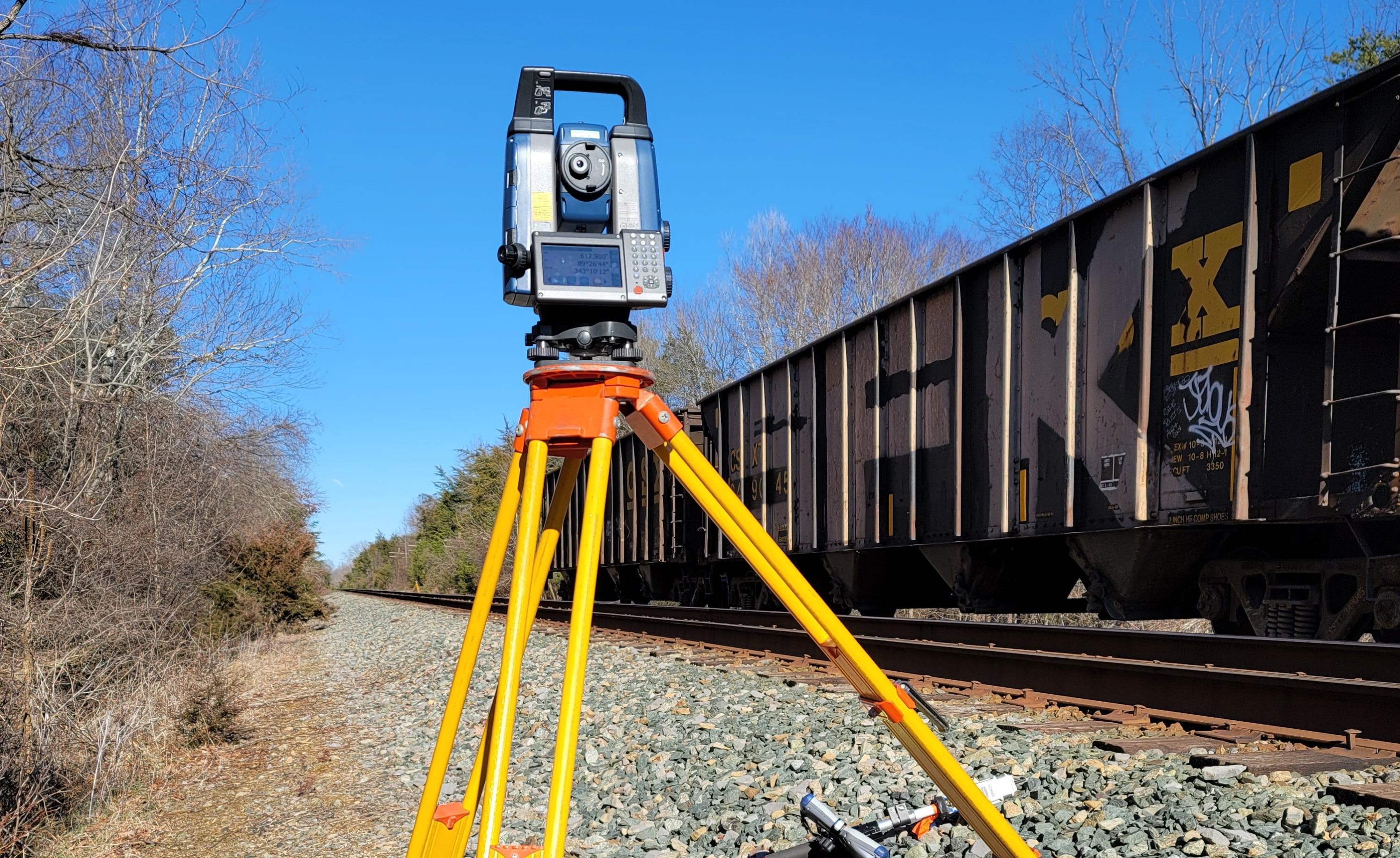 surveying device overlooking waterway and embankments