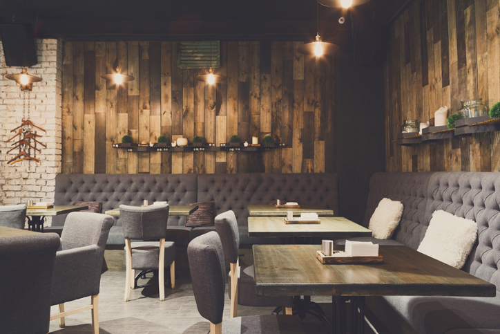 Cozy wooden interior of restaurant, copy space. Comfortable modern dining place, contemporary design background
