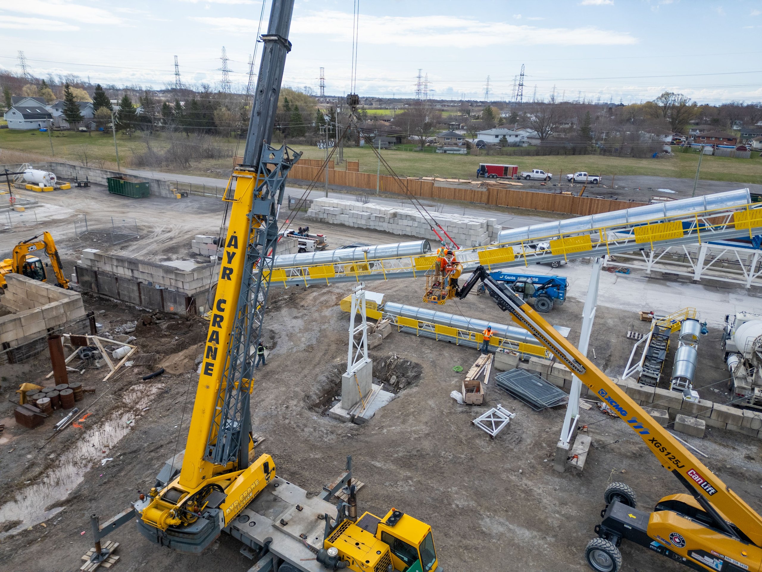 Aerial photo of a construction site with crane operation taken by a drone, showcasing ER Media’s ability to capture dynamic branding visuals for Ontario contractors.