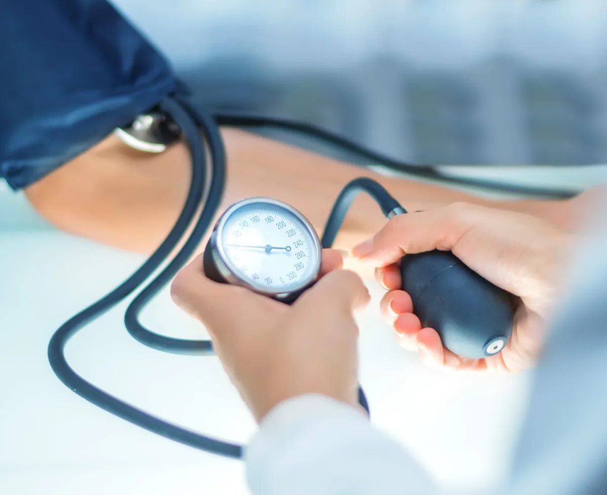 A doctor checking a patients blood pressure