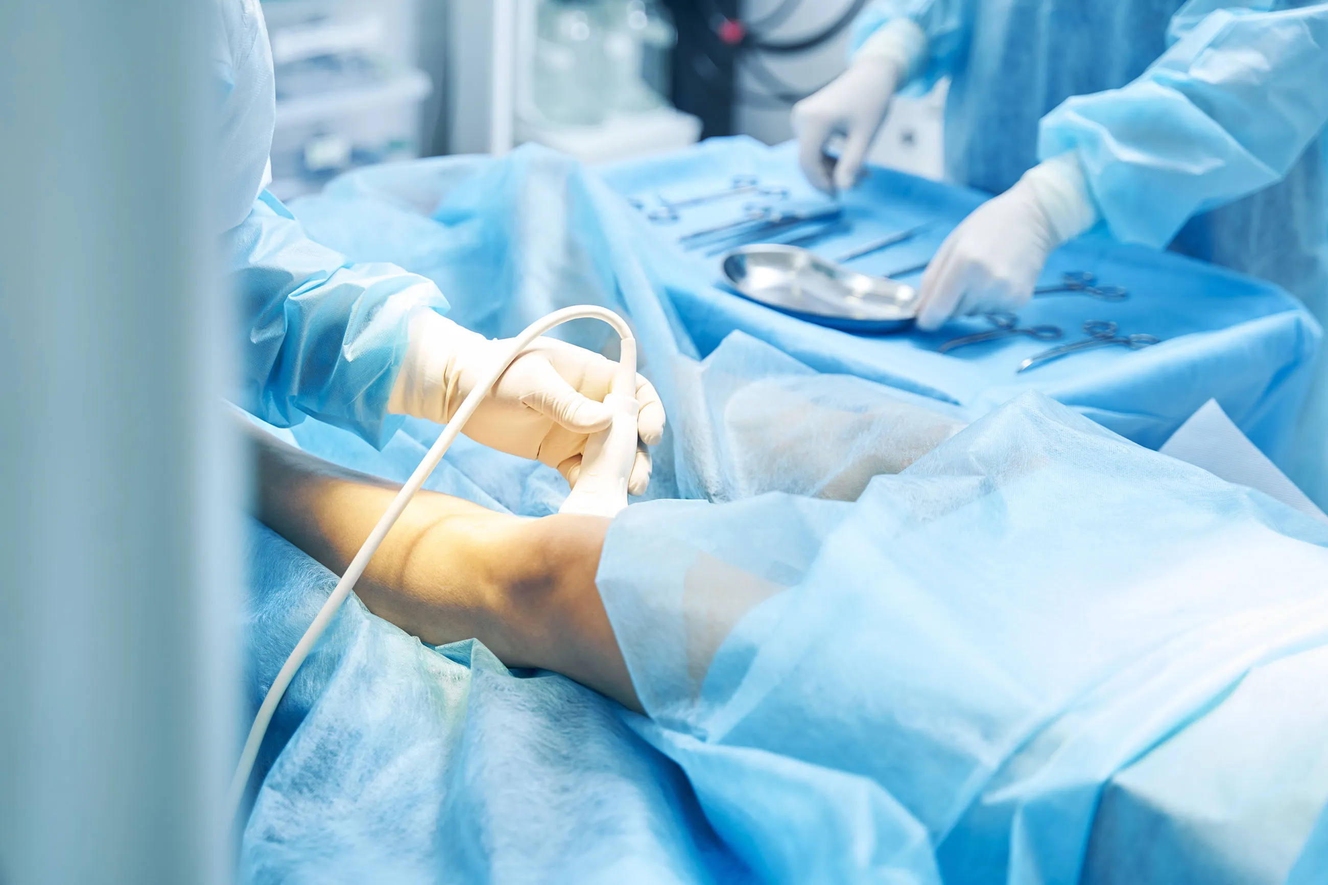 A doctor testing a patient's knee