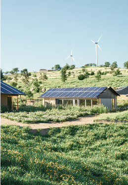 Buildings with solar panels and wind turbines on a grassy hill.
