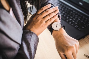 Person looking at her watch