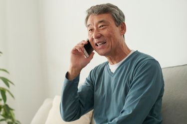 Man scheduling an appointment through phone