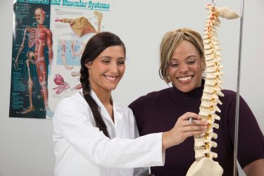 Chiropractor with a happy patient.