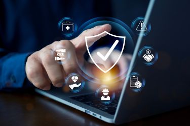 Person's hand selecting a software system