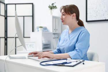 Medical practitioner on the computer
