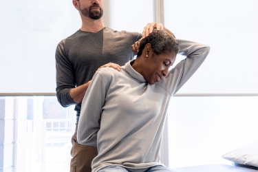 Happy patient in the chiropractor