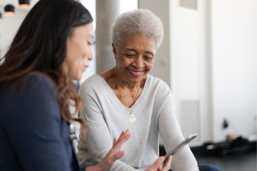 Patient with doctor and a tablet