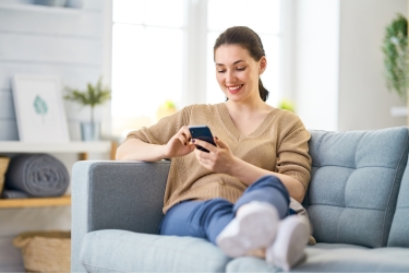Patient contacting medical provider comfortably from her living room