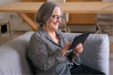 Woman using the tablet to give feedback