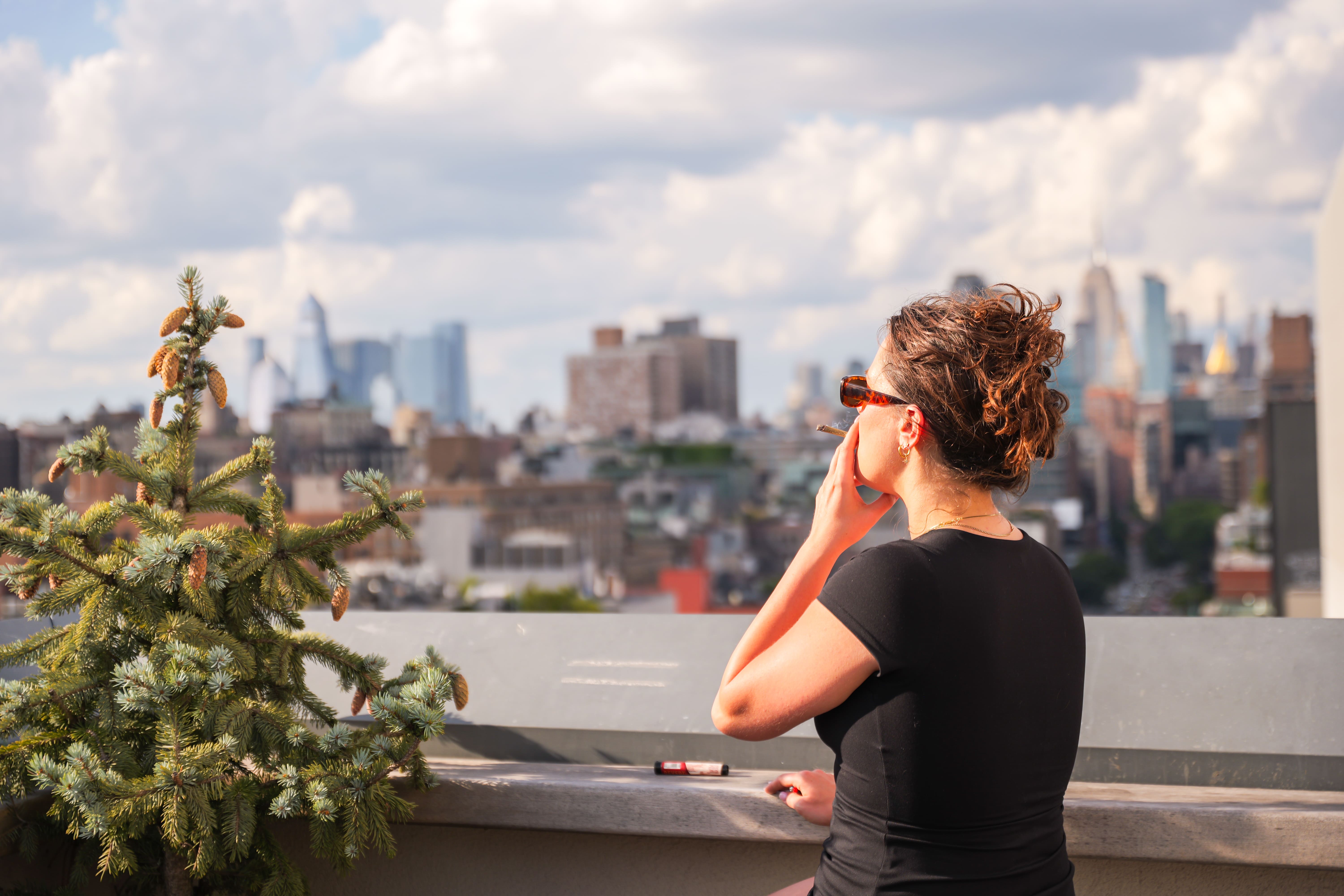 Picture of woman smoking a pre-roll