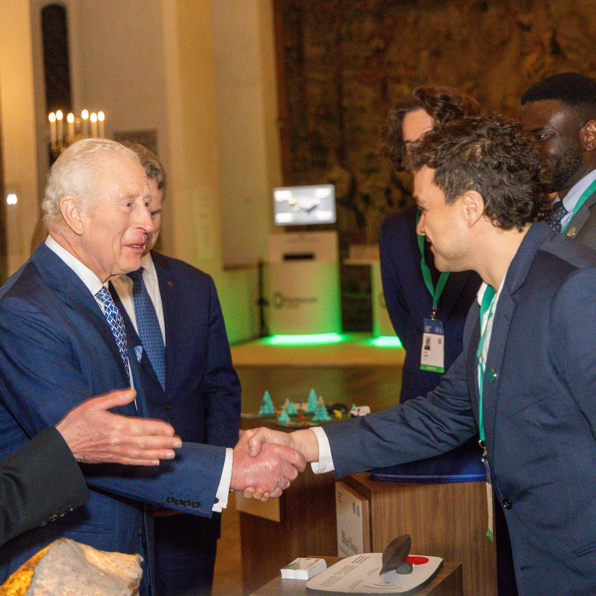 Pyri's CEO shaking the hand of King of England