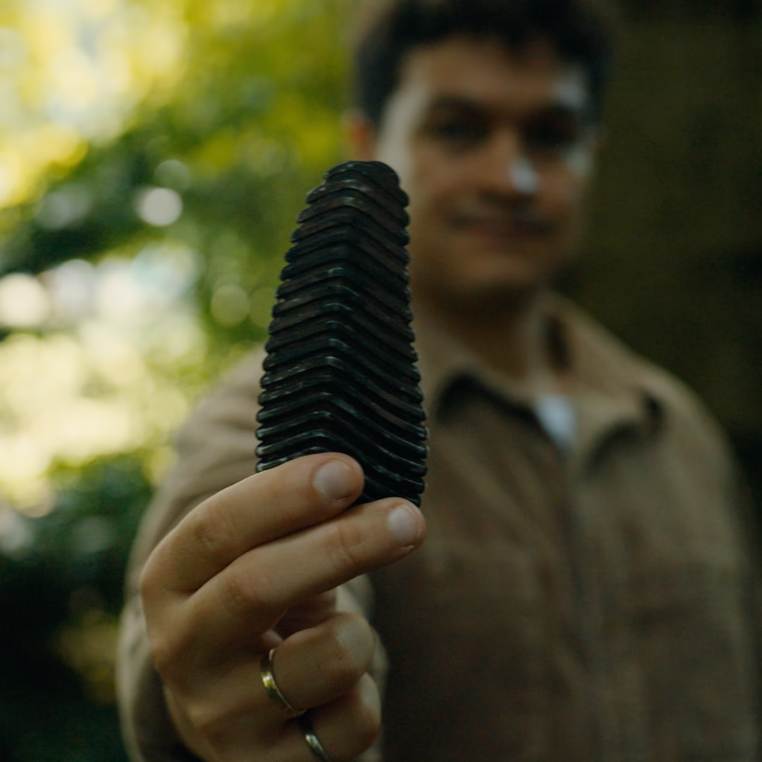 Pyri's pinecone-shaped wildfire detection sensor in the hand of the CEO