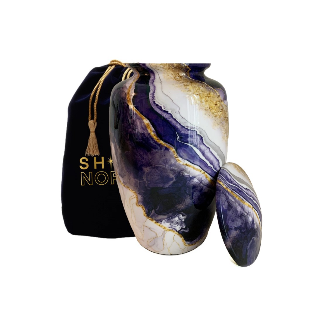 Dream River Cremation Urn with open lid showing blue watercolor design and silver trim by Shine North.