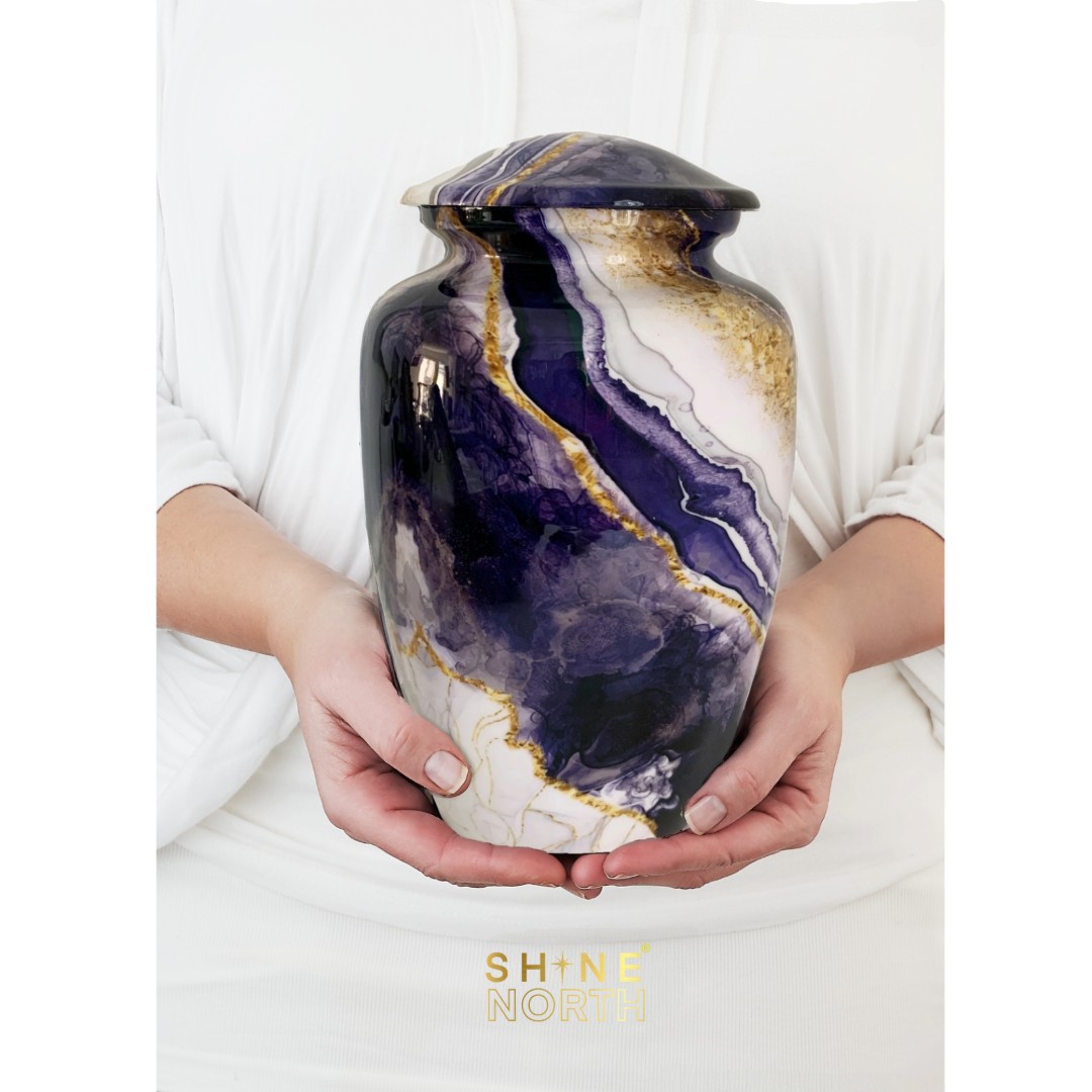 Dream River Cremation Urn for Human Ashes gently held in hands, showing size and elegant craftsmanship.