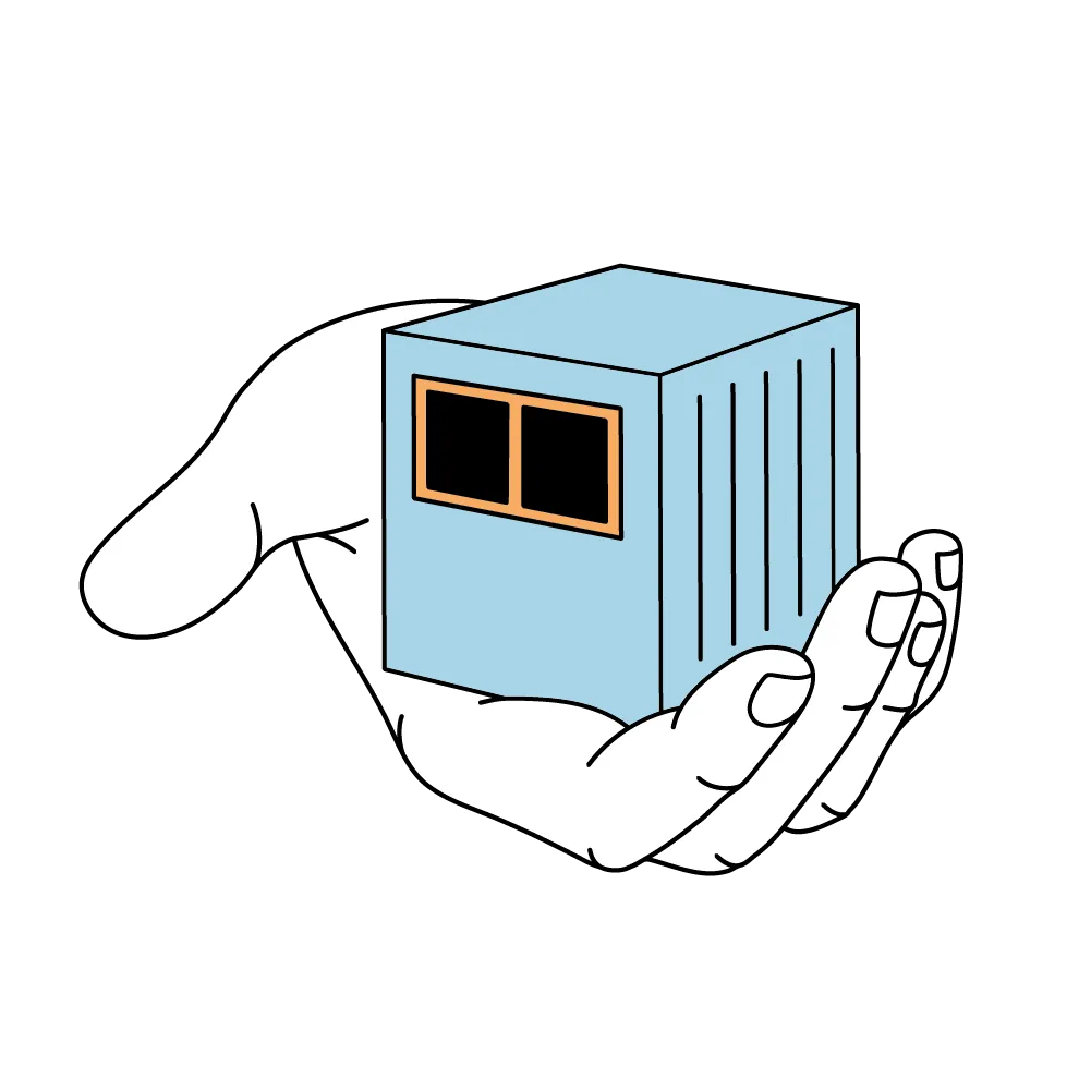 Eine Hand, die einen kleinen blauen Würfel mit zwei schwarzen Fenstern hält.
