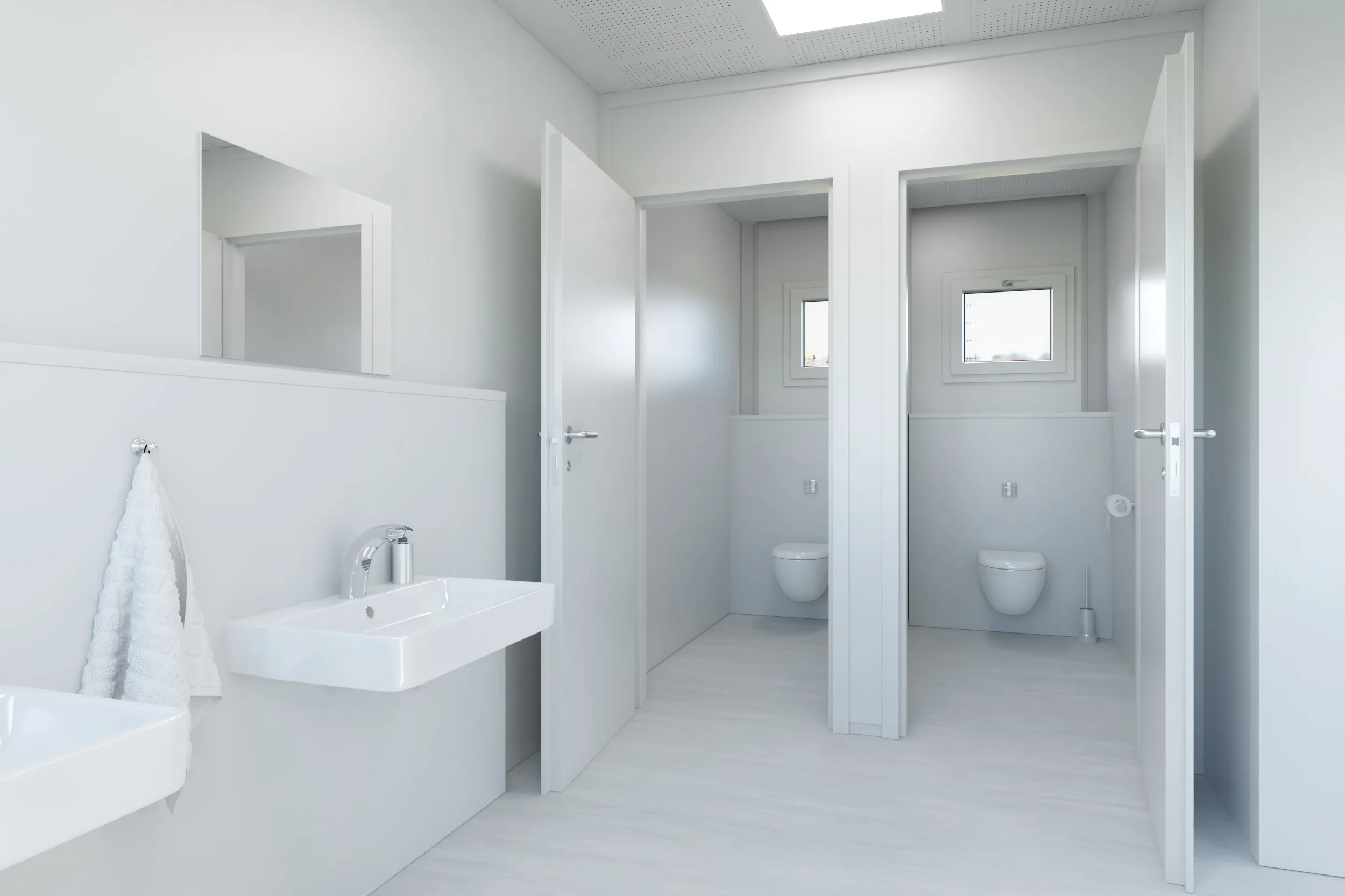 Helle, moderne öffentliche Toilette mit zwei offenen Kabinen mit Wandtoiletten, zwei weißen Waschbecken und einem Handtuch an der Wand.
