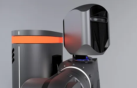 Close-up of a sleek, black and gray robot with a rectangular head featuring two front cameras and an orange stripe on its cylindrical body.
