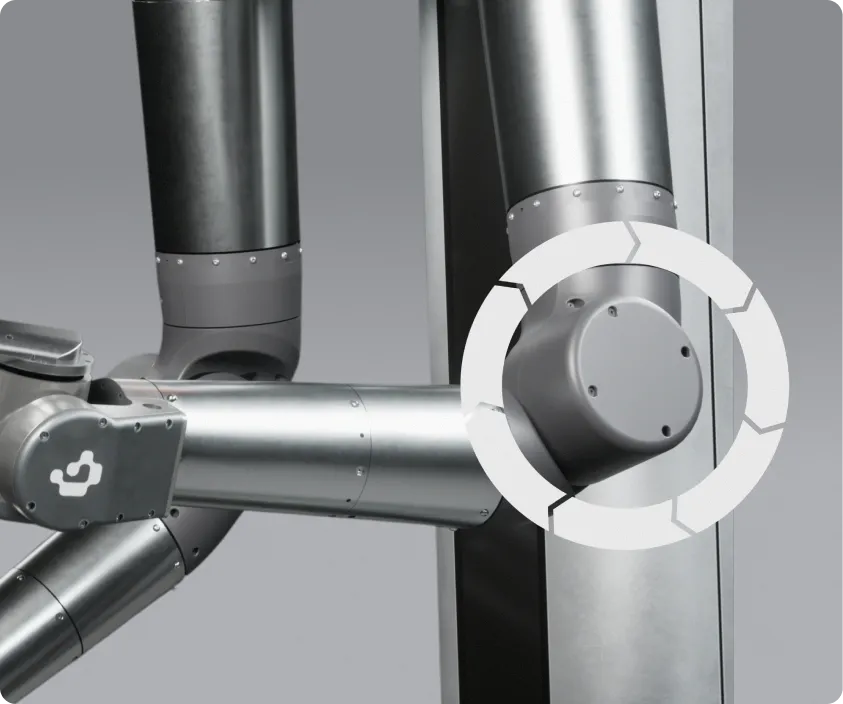Close-up of a silver robotic arm joint with a circular loading or processing icon overlaid.