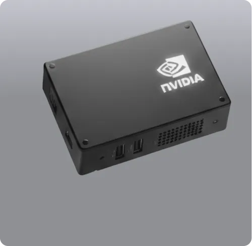 Black compact NVIDIA device with USB ports and ventilation grilles on a gray background.