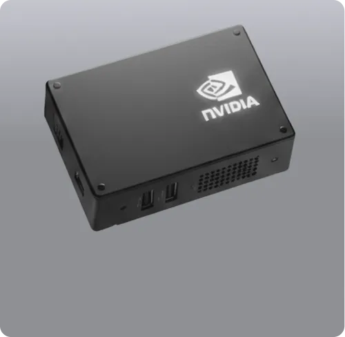 Black rectangular NVIDIA device with multiple USB ports and ventilation holes on the side.