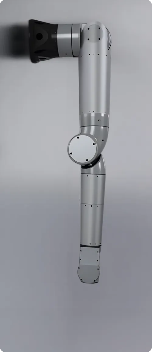 Silver robotic arm with multiple joints mounted on a gray wall.