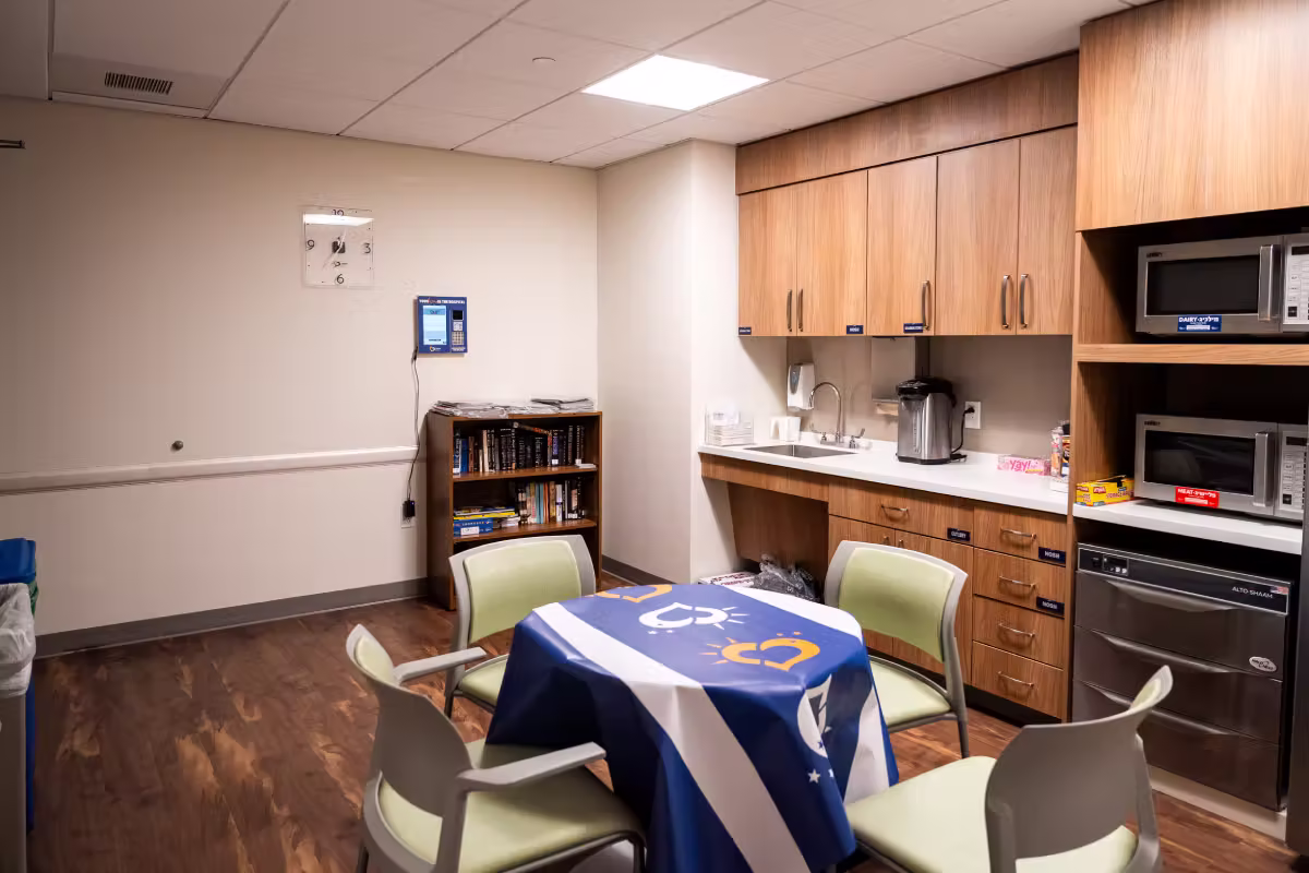 chesed apartment setup with food, seforim, and comforts