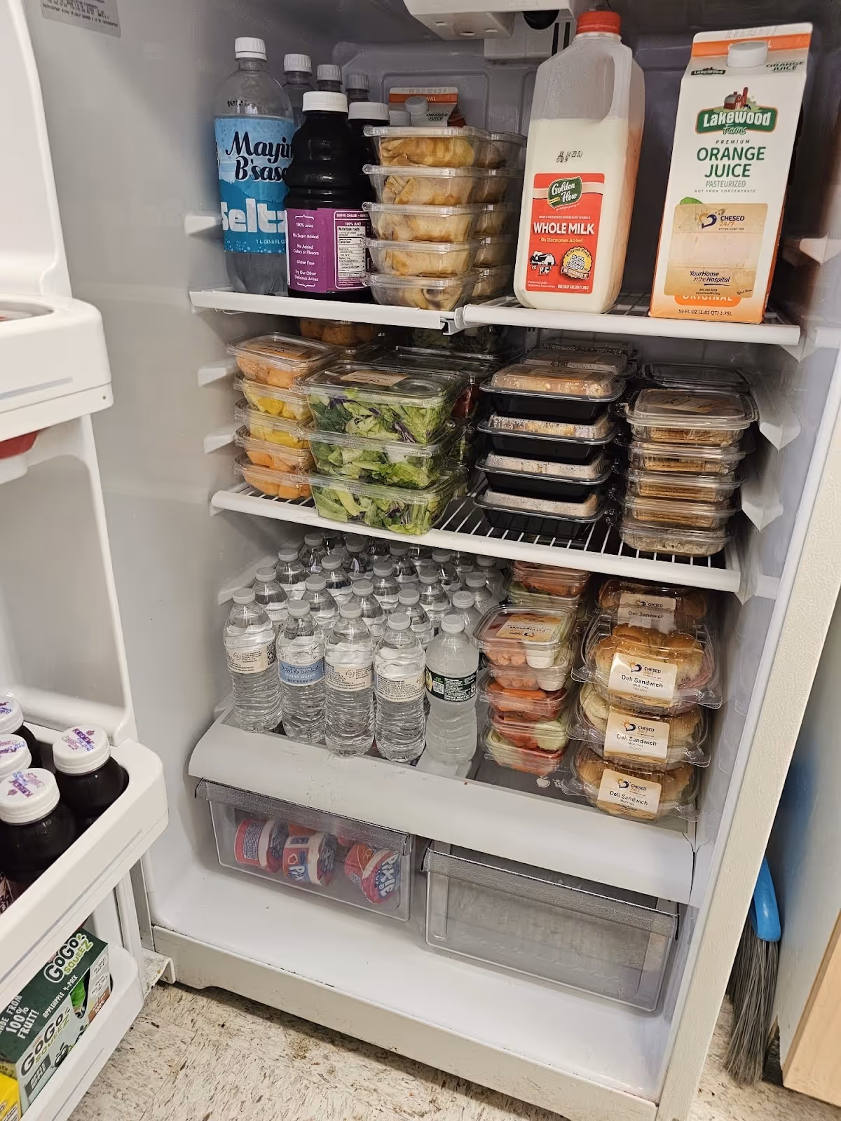 Fridge in Ellenville NY fully stocked with snacks drinks and meals on the go